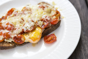 Breakfast menu, tomato and egg with cheese on toast, healthy food concept