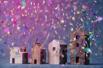 new house concept with house model wood box with color paper confetti