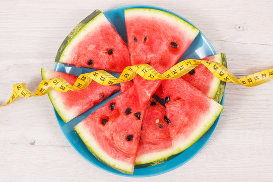 Fresh juicy watermelon and tape measure, healthy dessert and slimming concept