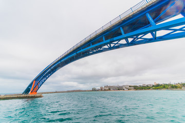 Blue and orange bridge on the ocean - 214416339