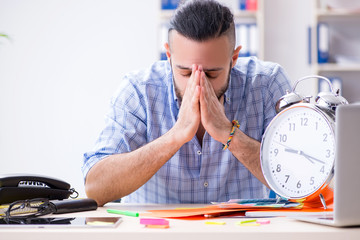 Young designer working in his studio on new project