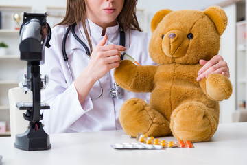 Child checking soft toy health