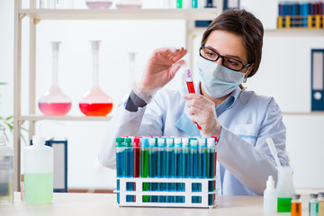 Female chemist working in hospital lab