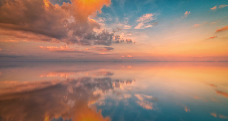 Long Exposure of Colorful sunset sky and reflection on sea. Vintage tone