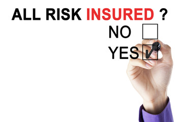 Businessman's hand approving all risk insured