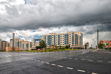 new buildings in the modern city. clean wet asphalt roads