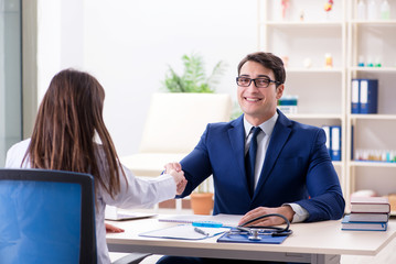 Man signing medical insurance contract