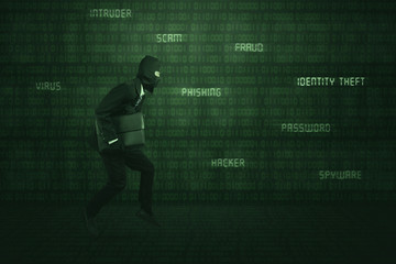 Fototapeta na wymiar Thief wearing business suit and mask running stealing laptop