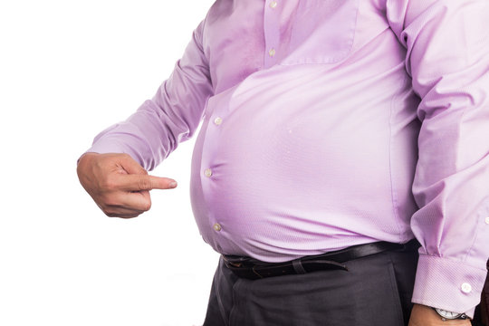 Man pointing own unhealthy big belly with visceral subcutaneous fats