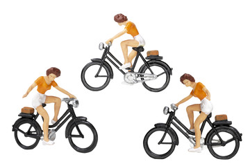 Miniature people travellers with bicycle isolate on white background with clipping path.