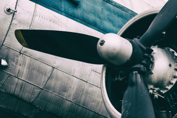 Detail of a vintage abandoned old airplane. Grunge wallpaper background. No people.