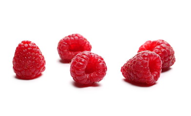 pile raspberries isolated on white