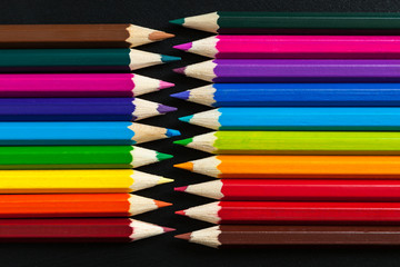 Colored pencils on the table top.