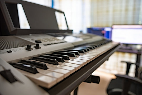 Electric piano in front of a working station