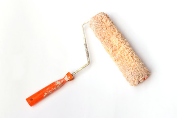 Used and dirty roller paint brush isolated on white background