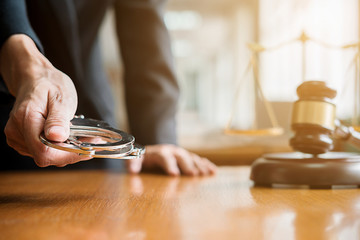 Judge gavel and Justice lawyer who holding handcuffs to offer legal solutions for customer. Concepts of Law and Legal service.
