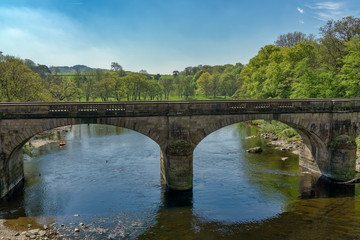 Fototapeta na wymiar A bridge over the River Lune near Lancaster.