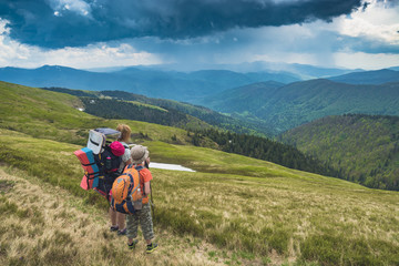 Fototapeta na wymiar Family hikers in a mountain valley