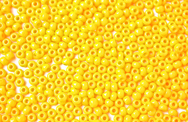 Mosaic made out of yellow beads. 