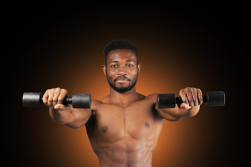 Fototapeta na wymiar Toned and ripped lean muscle fitness man lifting weights