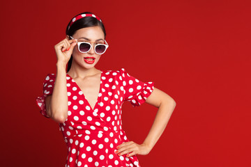 Portrait of a funny emotional young woman. Pin-up style.