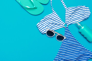 Beachwear and accessories on a blue background