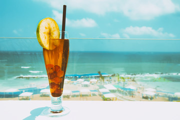  Cocktail drink on wood table on the sky background. Chill out and summer holiday concept