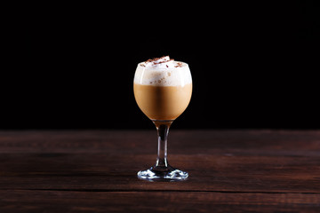 Vienna hot coffee with whipped cream in a glass, warming cozy drink, cafe or restaurant concept