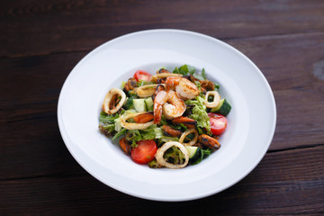 Healthy food, property nutrition,mediterranean diet.  Appetizing fresh vegetable and prawns salad. Delicious seafood 