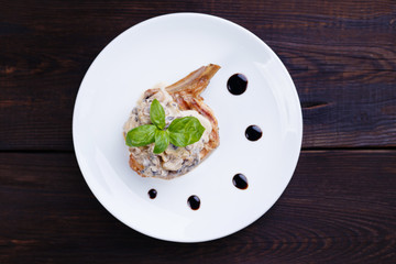 Grilled meat, steak restaurant, food photo art,menu concept. Pork ribs with mushrooms in creamy sauce, flat lay. Appetizing rustic meals