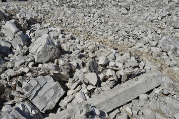 Texture in the form of scattered stones remains of a destroyed building. Background