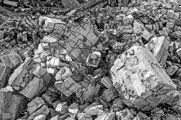 Texture in the form of scattered stones remains of a destroyed building. Background. Black and white image