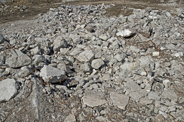 Texture in the form of scattered stones remains of a destroyed building. Background