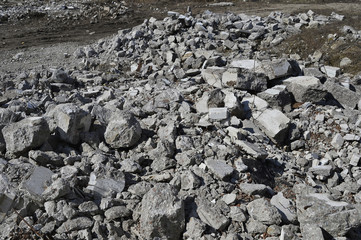 Texture in the form of scattered stones remains of a destroyed building. Background
