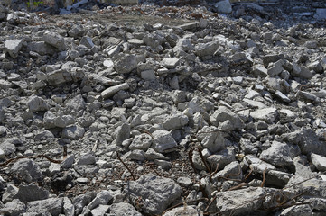 Texture in the form of scattered stones remains of a destroyed building. Background