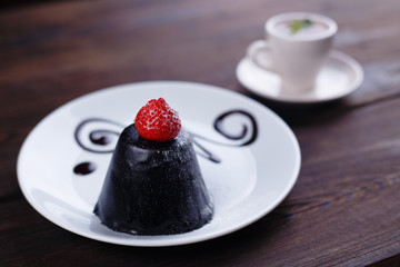 Trendy mousse chocolate cake decorated with strawberry, cafe or restaurant dessert menu