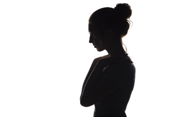 silhouette of a young woman on a white isolated background, face profile of a beautiful girl