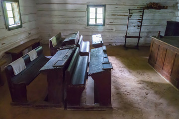 Museum exposition of the classroom with ancient wooden desks and educational facilities