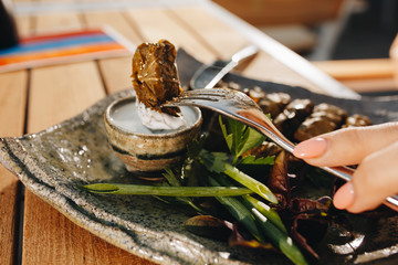 Caucasian traditional dish meat wrapped in grape leaves called dolma.
