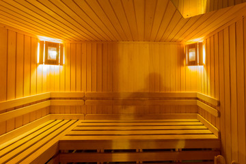 Obraz na płótnie Canvas Finnish sauna with two lamps in the corners