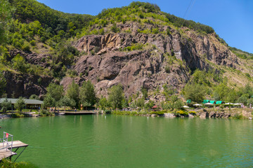 Fototapeta premium Lake in the rocky terrain. You can jump into the water from a height