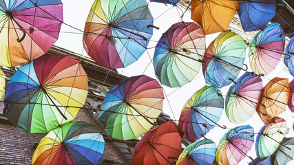Fototapeta na wymiar Street Decorated With Rainbow Color Umbrellas, Istanbul, Turkey