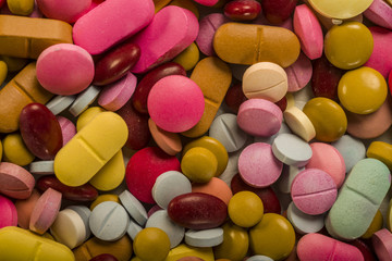 Fototapeta na wymiar Stack of colorful pills 