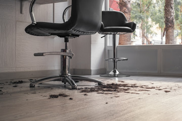 Cut hair on the floor in a hairdressing salon