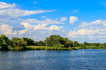 Fototapeta premium Summer landscape with beautiful lake, green trees and blue sky