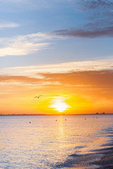 Beautiful summer sunset with clouds over the sea