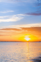 Beautiful summer sunset with clouds over the sea