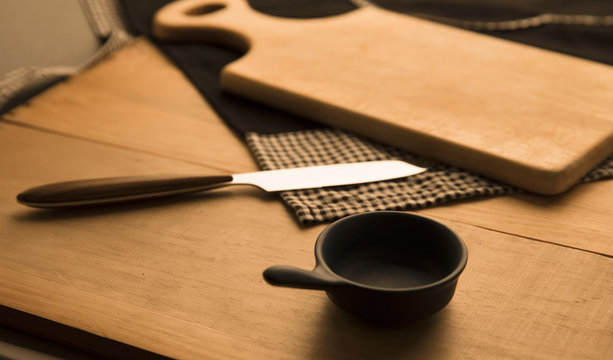 Cooking tools and cooking preparations. A dining table image reminiscent of a meal preparation.