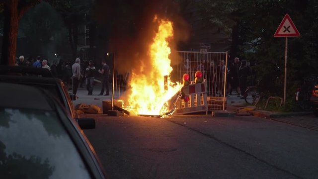 13% of real time slow motion shot of a fire caused by demonstrators during G20 summit in Hamburg, Germany
