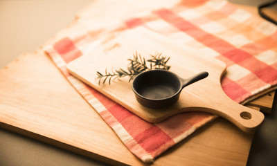 Cooking tools and cooking preparations. A dining table image reminiscent of a meal preparation.
